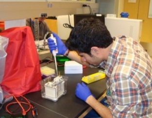 student pipetting in lab